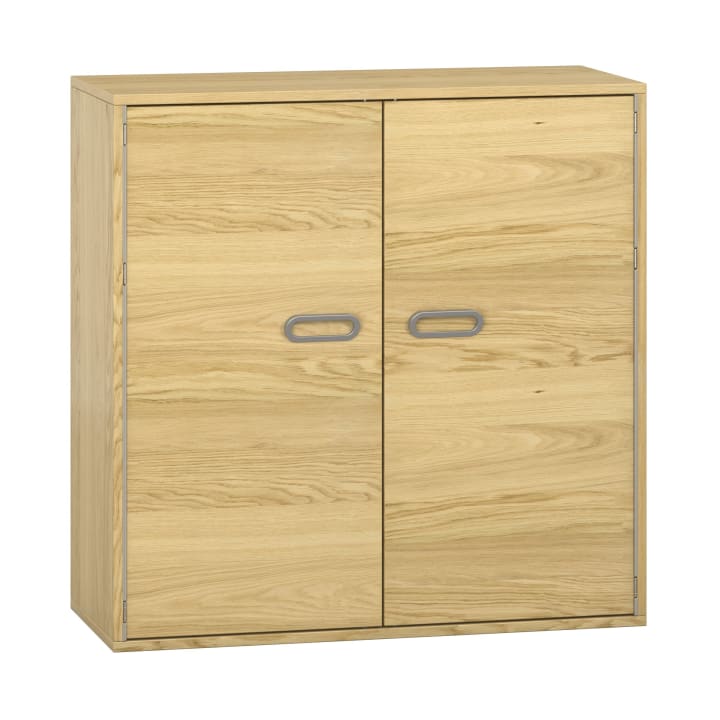 Ein heller Holzschrank mit zwei Türen und ovalen, grauen Griffen, der auf einer ebenen Fläche steht. Der Schrank hat ein einfaches, rechteckiges Design.