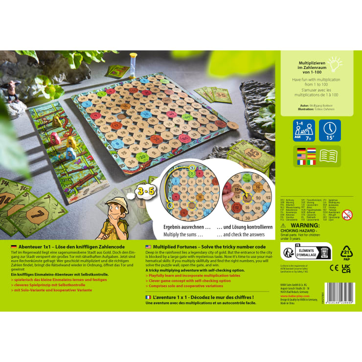 Auf einem Tisch liegt ein buntes Brettspiel mit nummerierten sechseckigen Feldern, Spielsteinen aus Pappe und Karten. Spielanleitung und Details sind in Deutsch, Französisch und Englisch auf dem grünen Schachtelhintergrund abgedruckt.