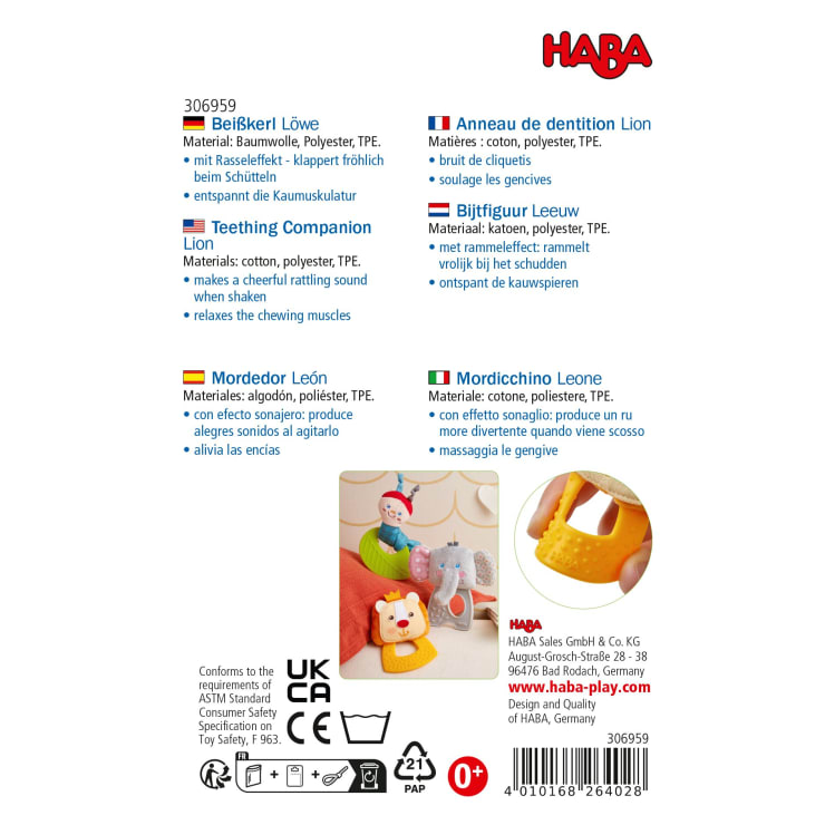 Produktverpackung für ein HABA-Beißspielzeug in Form eines Löwen. Die Verpackung enthält eine mehrsprachige Auflistung der Materialien und Funktionen, Bilder des Spielzeugs und des Babys im Gebrauch sowie Sicherheits- und Herstellerinformationen.