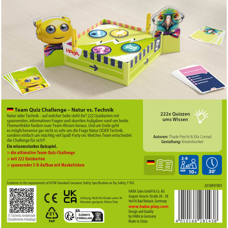 Eine farbenfrohe Brettspielschachtel mit Quizkarten, einer Punktetafel, zwei verspielten Maskenfiguren und einem Quiz-Buzzer. Die Verpackung hebt das Thema "Natur gegen Technik" hervor und enthält ausführliche Spielinformationen in deutscher Sprache.