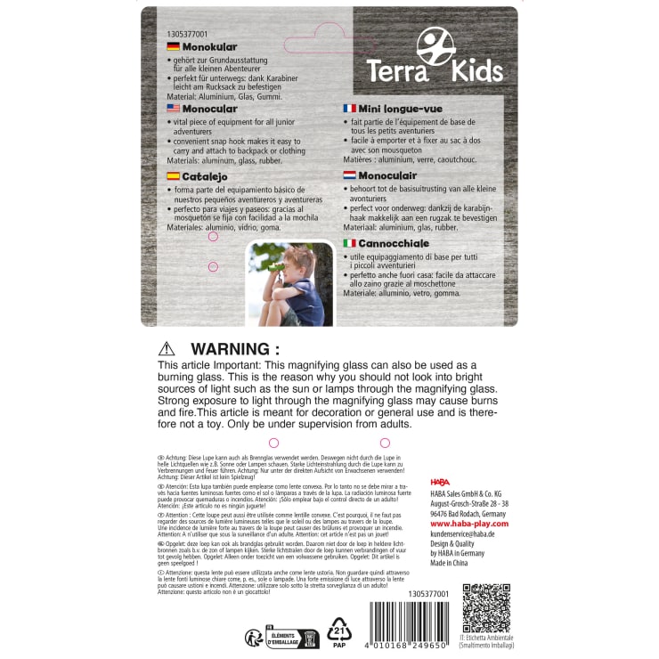 Rückseite einer Terra Kids Lupenverpackung mit Produktbeschreibungen in mehreren Sprachen, Sicherheitswarnungen, Materialien, Unternehmensinformationen, Strichcode und Recycling-Symbolen auf weißem Hintergrund.