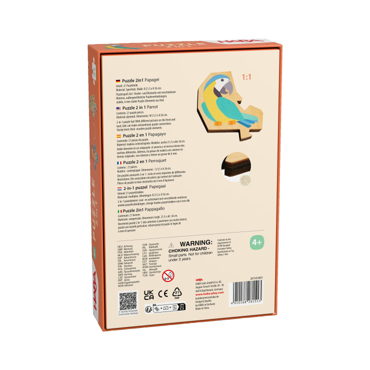 Die Rückseite einer Kinderpuzzlebox mit der Illustration eines Papageienpuzzles aus Holz, Produktinformationen in mehreren Sprachen, einer Altersempfehlung ab 4 Jahren, Sicherheitshinweisen und Herstellerangaben.