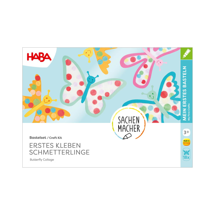 Eine Bastelbox mit der Aufschrift HABA Erstes Kleben Schmetterlinge mit bunten Illustrationen von Schmetterlingen mit lächelnden Gesichtern und Punkten auf weißem Hintergrund. Für Kinder ab 3 Jahren.