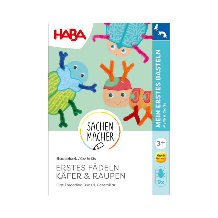 Eine Bastelpackung mit der Aufschrift HABA zeigt bunte Cartoon-Käfer und eine Raupe aus Pfeifenreinigern. Der Text auf der Schachtel lautet Erstes Fädeln Käfer & Raupen und My First Crafts. Für Kinder ab 3 Jahren.
