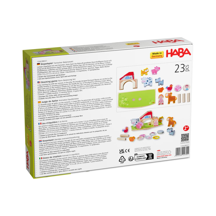Rückseite einer HABA-Spielzeugschachtel mit Spielfiguren, darunter Holztiere, Haus, Brücke und Würfel. Die Schachtel zeigt eine mehrsprachige Anleitung, das HABA-Logo, Made in Germany und gibt an, dass das Set 23 Teile für Kinder ab 2 Jahren enthält.