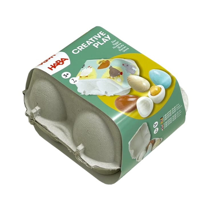 Ein Spielzeugeierkarton mit der Aufschrift Creative Play enthält sechs bunte Spielzeugeier in einem grauen Pappbehälter. Die Verpackung zeigt eine Illustration der Eier und gibt an, dass sie für Kinder ab 3 Jahren geeignet sind.