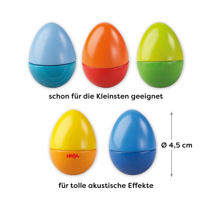 Abgebildet sind fünf bunte, eiförmige Shaker in den Farben Blau, Orange, Grün, Gelb und Blau. Der Text weist darauf hin, dass sie für kleine Kinder geeignet sind, gute Klangeffekte erzeugen und jedes Ei einen Durchmesser von 4,5 cm hat.