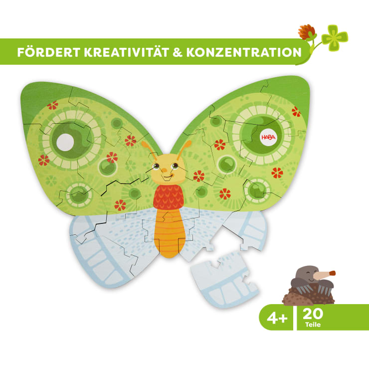 Ein farbenfrohes Schmetterlingspuzzle mit grünen und blauen Flügeln, einem orange-gelben Körper und zwei fehlenden Teilen. Das Puzzle ist für Kinder ab 4 Jahren geeignet und enthält 20 Teile. Der Text oben lautet: FÖRDERT KREATIVITÄT & KONZENTRATION.