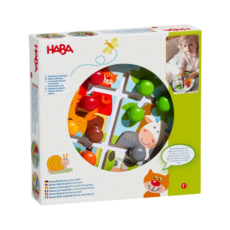 Ein verpacktes Labyrinthspiel der Marke HABA für Kleinkinder mit Tierillustrationen und bunten Knöpfen. Die Verpackung zeigt ein Foto eines spielenden Kindes und Produktinformationen in mehreren Sprachen. Geeignet für das Alter von 1 Jahr und älter.