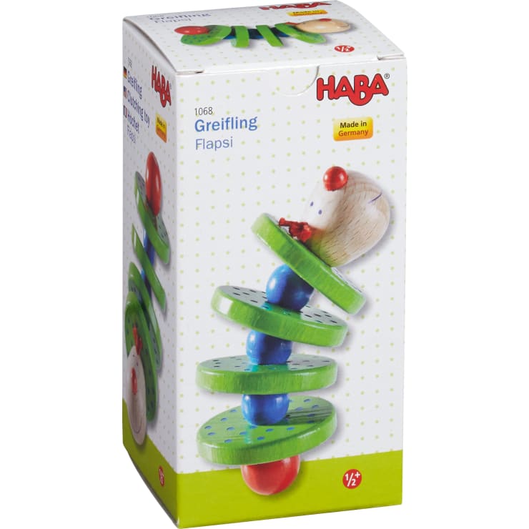 Rechteckige Schachtel mit der Abbildung eines hölzernen Greifspielzeugs mit grünen Scheiben, blauen und roten Perlen und einer mausförmigen Figur. Die Schachtel ist mit "HABA 1068 Greifling Flapsi" und "Made in Germany" beschriftet.
