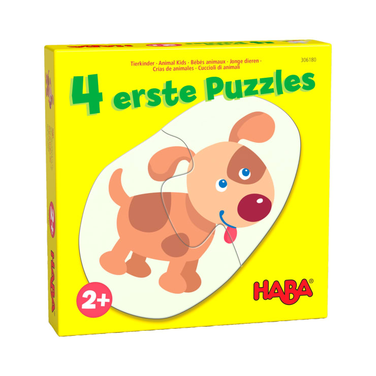 Eine gelbe Schachtel mit dem Text 4 erste Puzzles und einer Illustration eines Cartoon-Hundes. Die Schachtel ist für Kinder ab 2 Jahren geeignet und zeigt das HABA-Logo in rot in der unteren rechten Ecke.
