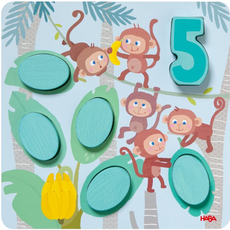 Ein illustriertes Puzzle zeigt fünf Affen in einer Dschungelszene mit Bananenbäumen. Es besteht aus sechs ovalen Teilen und einer großen türkisfarbenen Zahl 5. Unten links ist ein Bündel gelber Bananen zu sehen.