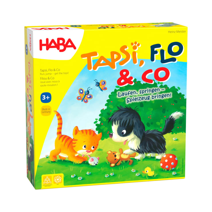Eine gelbe Schachtel des Brettspiels Tapsi, Flo & Co von HABA mit Illustrationen von einer Katze, einem Hund, einer Ente, Schmetterlingen und bunten Spielsteinen auf Gras. Das Spiel ist für Kinder ab 3 Jahren geeignet.