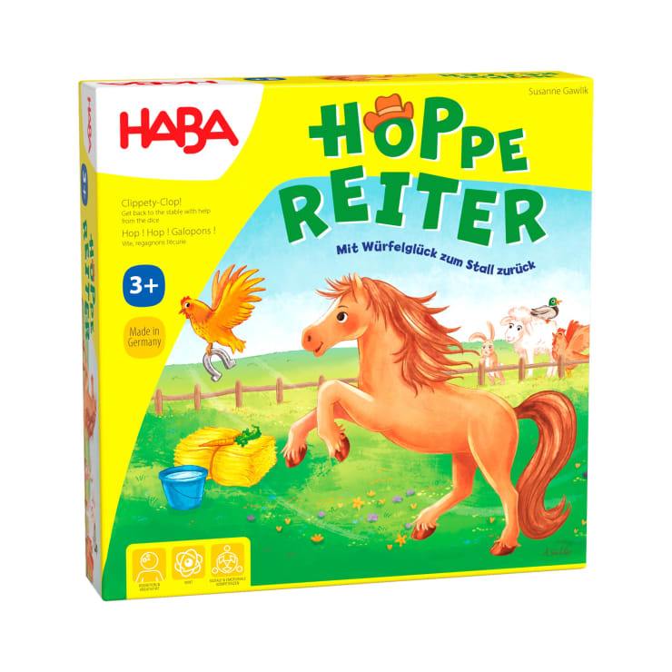 Eine gelbe HABA-Spielschachtel zeigt ein Cartoon-Pferd, einen Vogel und eine Maus im Gras neben einem Zaun. Der Titel "Hoppe Reiter" ist in großer grüner und blauer Schrift aufgedruckt. Auf der Schachtel steht, dass das Spiel für Kinder ab 3 Jahren geeignet ist.