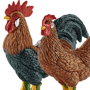 Abgebildet sind zwei realistische Figuren eines Hahns und einer Henne. Der Hahn hat ein schwarzes und rostrotes Gefieder mit rotem Kamm und Kehllappen, während die Henne ein braunes Gefieder mit rotem Kamm hat. Beide stehen Seite an Seite.