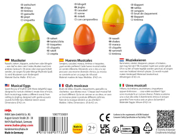 Fünf bunte, eiförmige Musikspielzeuge sind in den Farben Blau, Grün, Gelb, Orange und Rot abgebildet und jeweils in mehreren Sprachen beschriftet. Die Verpackung enthält Produktdetails, Sicherheitssymbole und Unternehmensinformationen.
