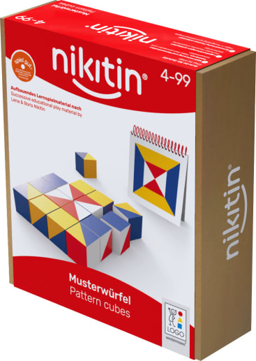 Eine Schachtel Nikitin Musterwürfel für die Altersgruppe 4-99. Die Verpackung zeigt eine Anordnung von farbigen Würfeln und ein Heft mit geometrischen Mustern auf weißem Hintergrund.