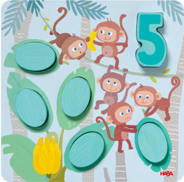 Ein illustriertes Puzzle zeigt fünf Affen in einer Dschungelszene mit Bananenbäumen. Es besteht aus sechs ovalen Teilen und einer großen türkisfarbenen Zahl 5. Unten links ist ein Bündel gelber Bananen zu sehen.