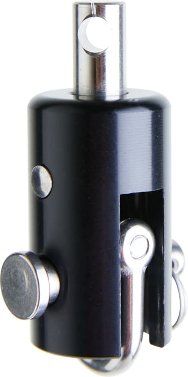 Nahaufnahme eines mechanischen Bauteils aus schwarzem und silbernem Metall mit zylindrischen und rechteckigen Formen, das einen runden Knopf und ein freiliegendes Innenteil aufweist.